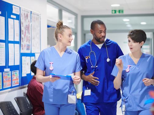 Group of trainee doctors in corridor close up