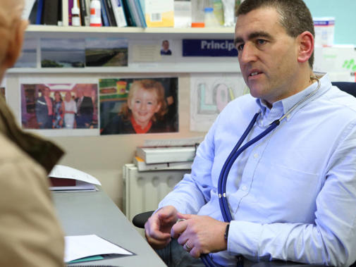 Male GP With Patient